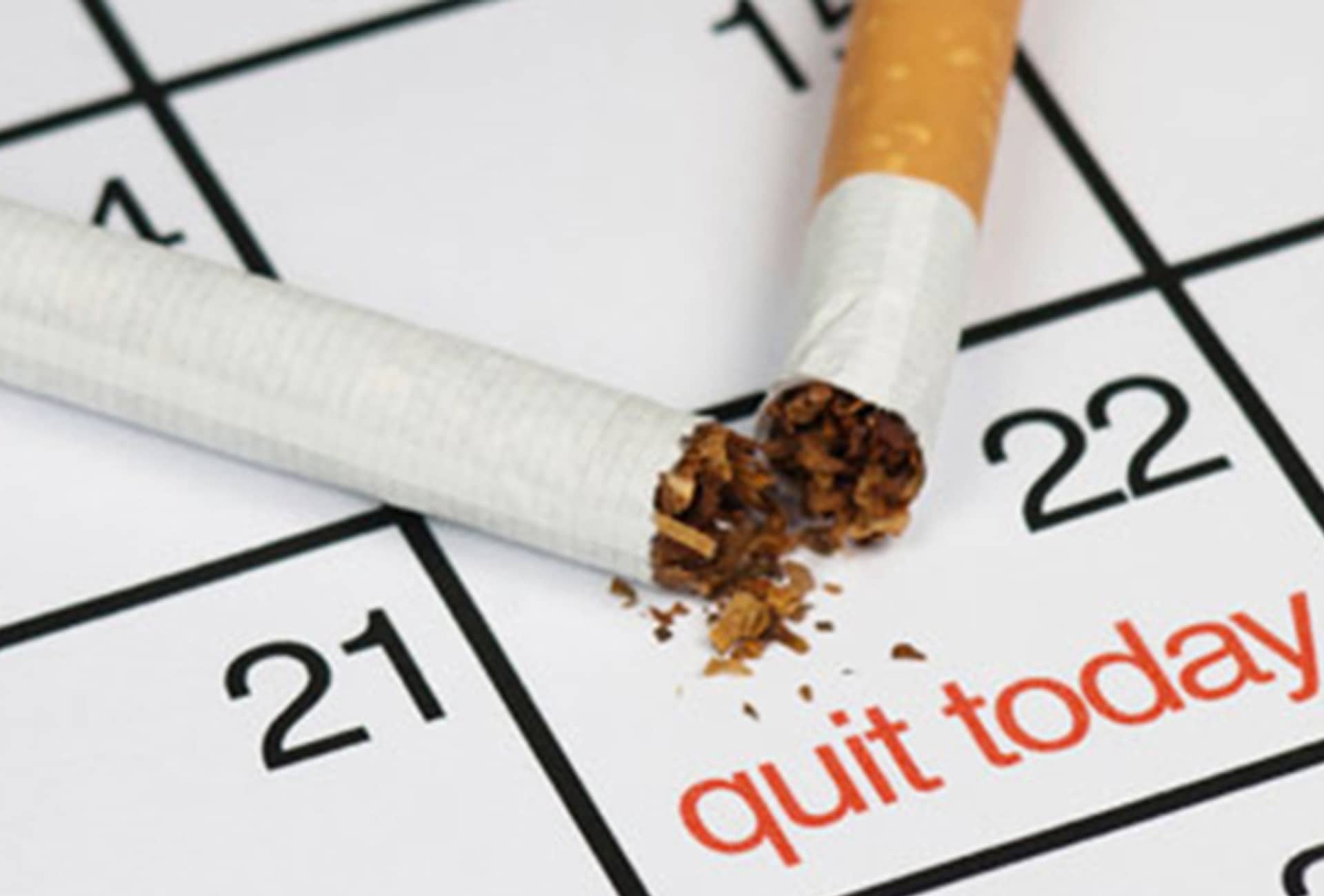 Stop smoking images of a calendar with a cigarette stubbed out